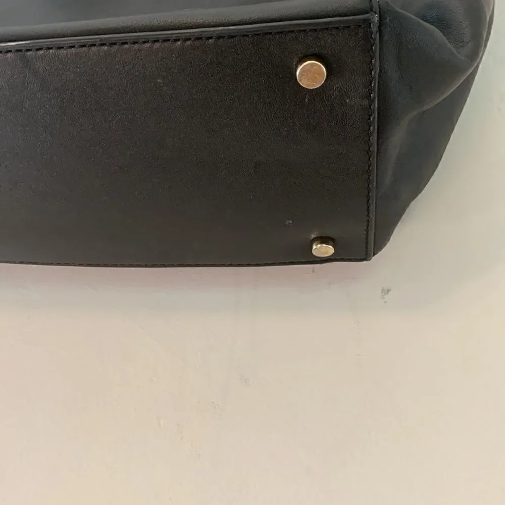 Kate Spade black leather tote bag with exterior and interior pockets